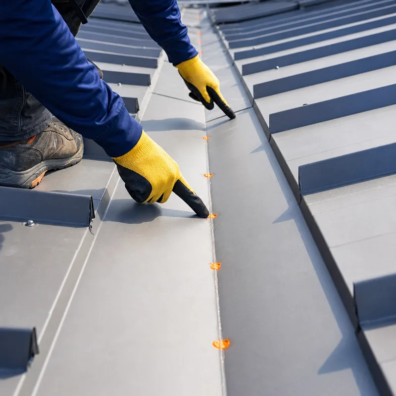 Metal roof valley flashing with clean laps and indicated sealant locations